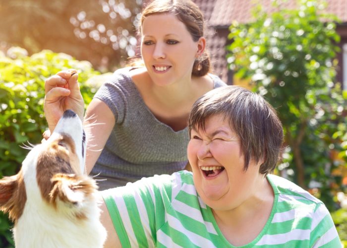 Mentally,Disabled,Woman,With,A,Second,Woman,And,A,Companion